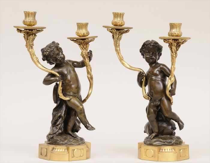 Appraisal: PAIR OF LOUIS XVI-STYLE PATINATED AND GILT-BRONZE FIGURAL TWO-LIGHT CANDELABRA