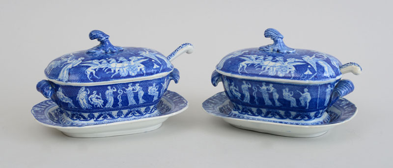 Appraisal: PAIR OF ENGLISH BLUE TRANSFER-PRINTED POTTERY SAUCE TUREENS COVERS STANDS