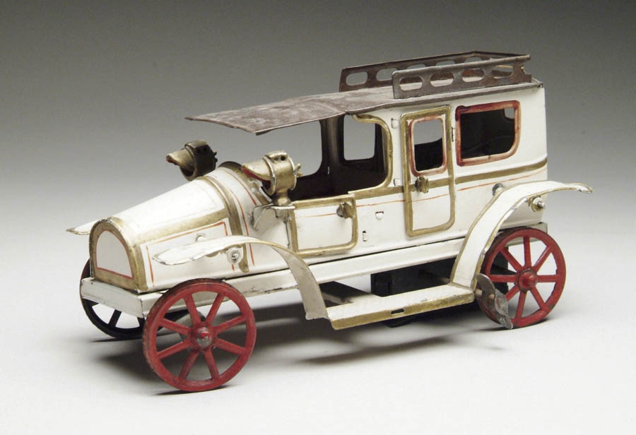 Appraisal: GUNTHERMANN HAND PAINTED LIMOUSINE Clockwork toy features four opening doors