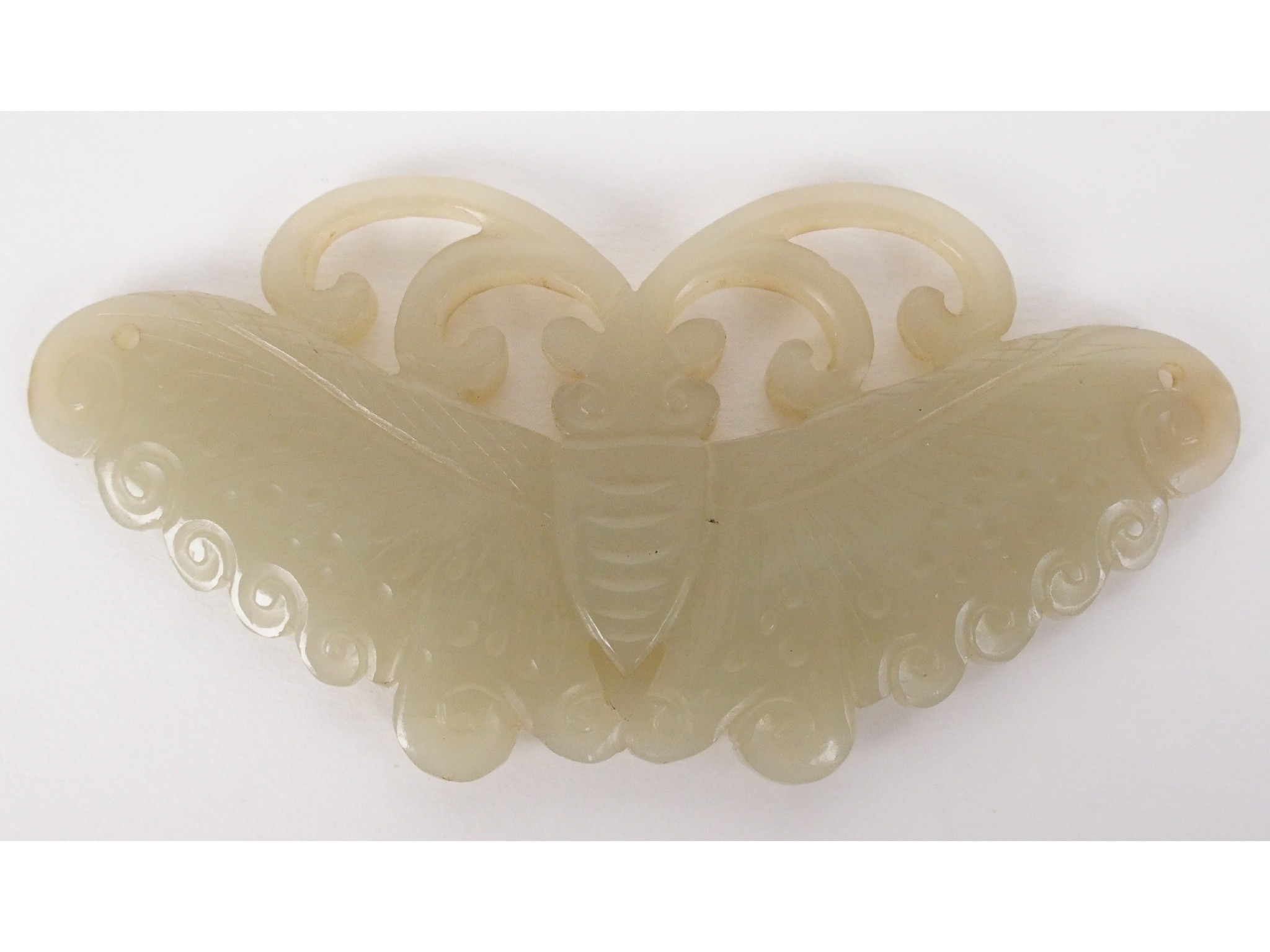 Appraisal: A Chinese Jade caving of a butterflywith pierced wings cm