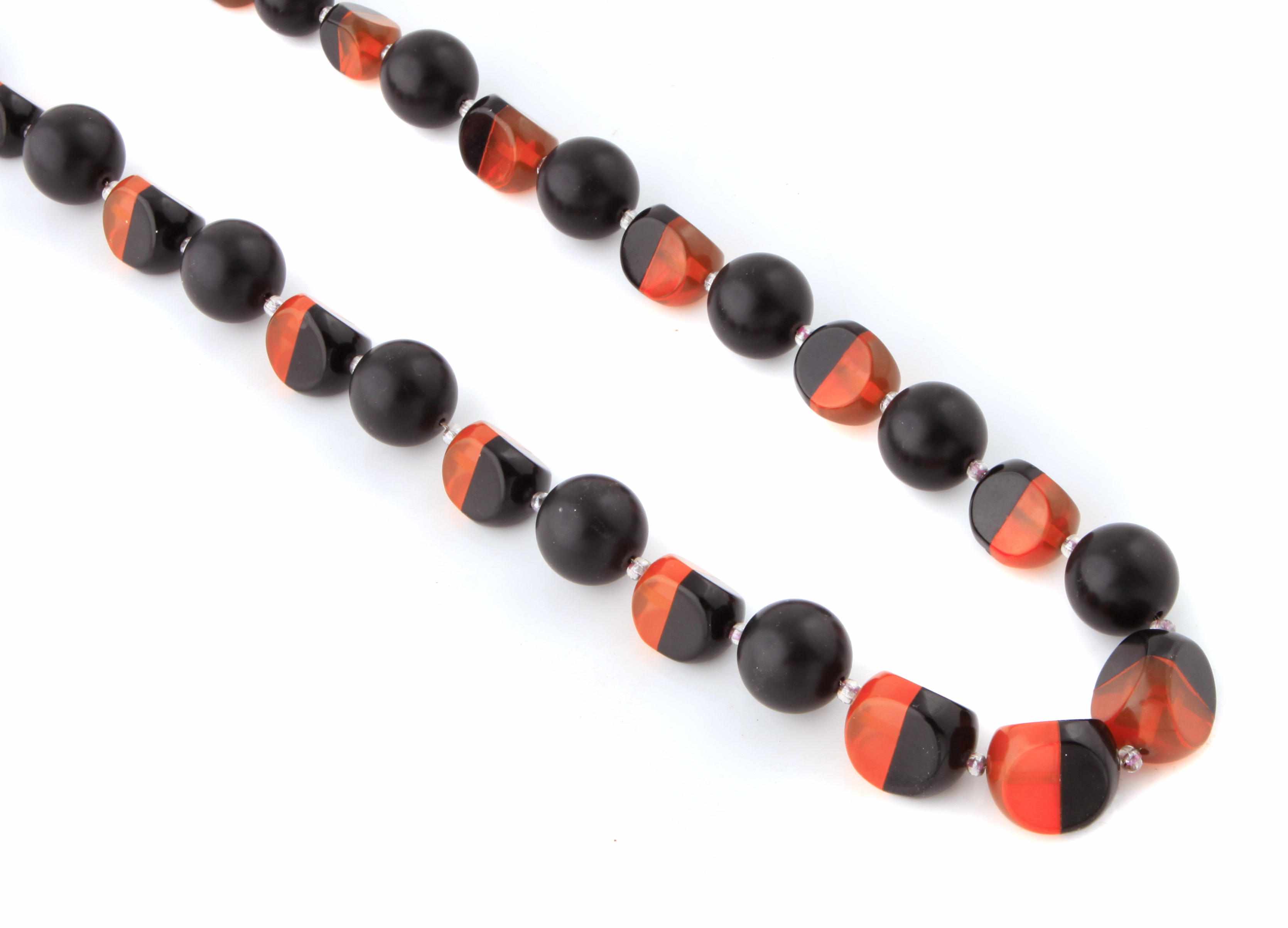 Appraisal: A two-tone Bakelite bead necklace Hobe length in