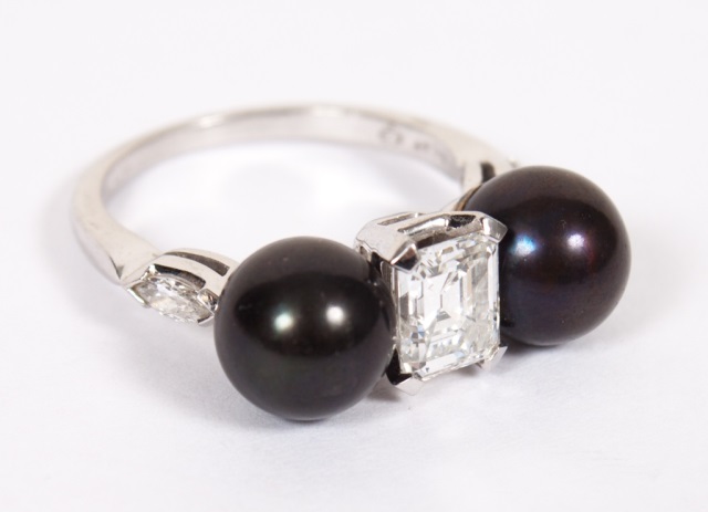 Appraisal: Lady's platinum diamond and black pearl ring containing an emerald-cut