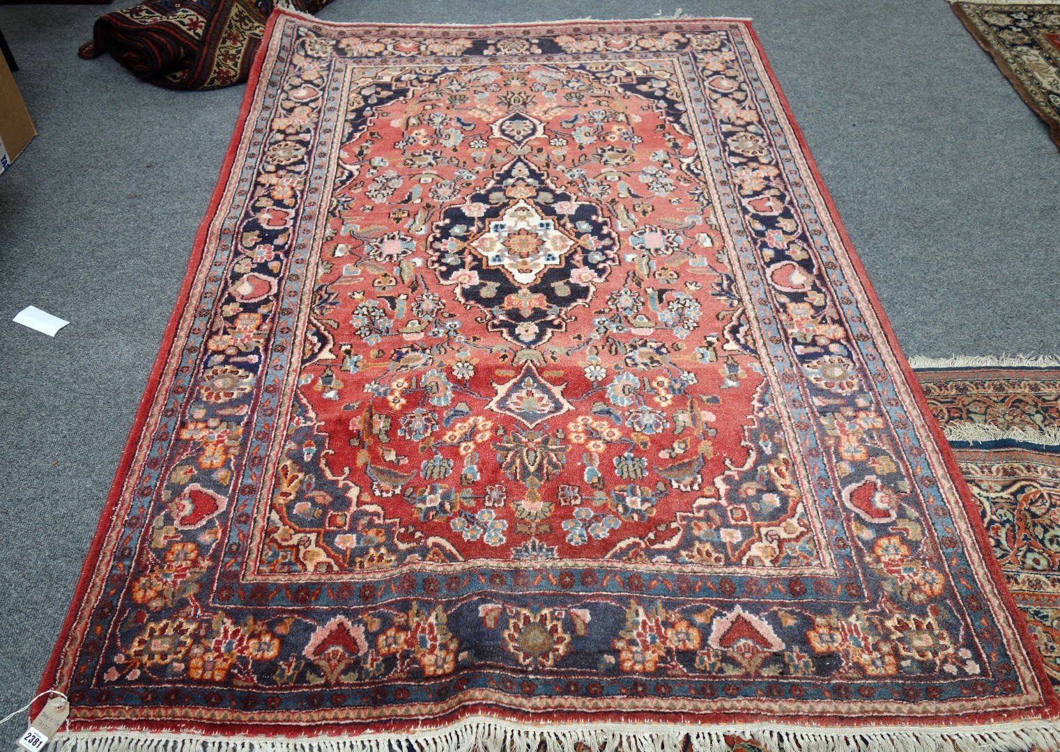 Appraisal: A Sarough rug Persian the madder field with a black