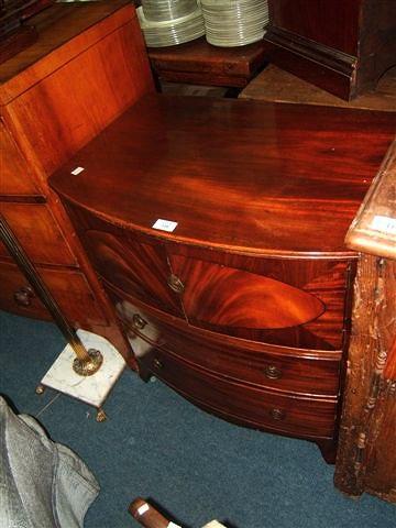 Appraisal: A Regency mahogany converted bow fronted commode with two cupboards