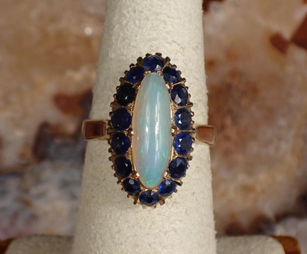 Appraisal: OPAL SAPPHIRE AND FOURTEEN KARAT GOLD RING The yellow gold