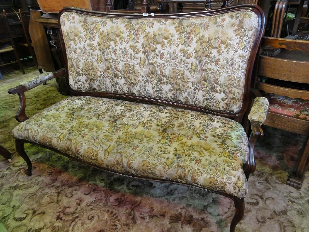 Appraisal: A continental couch with upholstered seat and back within a