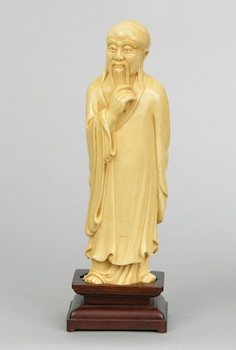 Appraisal: A Carved Ivory Figure of A Scholar Chinese Late th