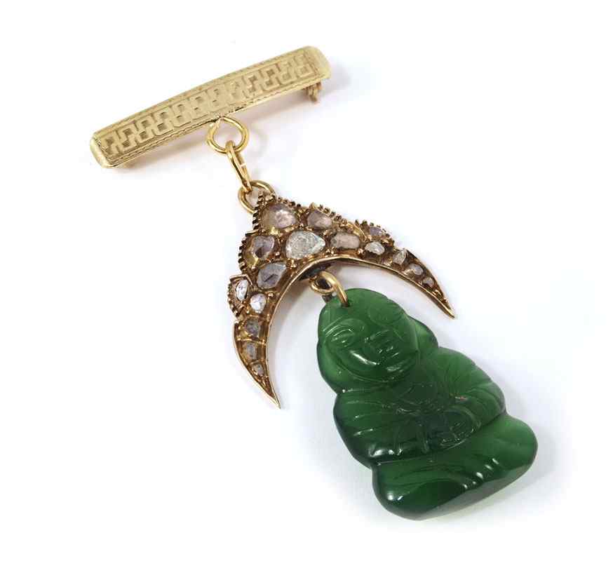 Appraisal: K DIAMOND BUDDHA PIN K yellow gold pin contains irregular