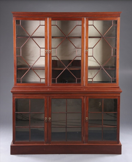 Appraisal: GEORGE III STYLE MAHOGANY BREAKFRONT BOOKCASE th century in two