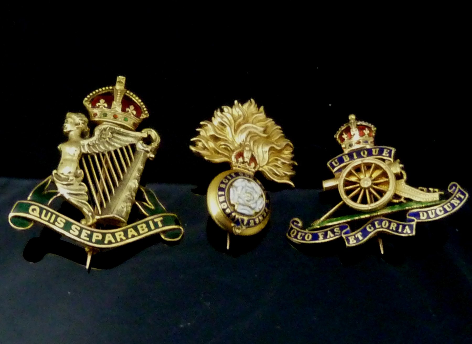 Appraisal: Three enamel and gold brooches of regimental interest the Royal