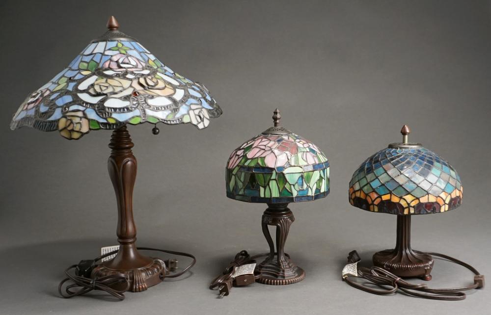 Appraisal: Three Tiffany Style Patinated Metal and Leaded Glass Table Lamps