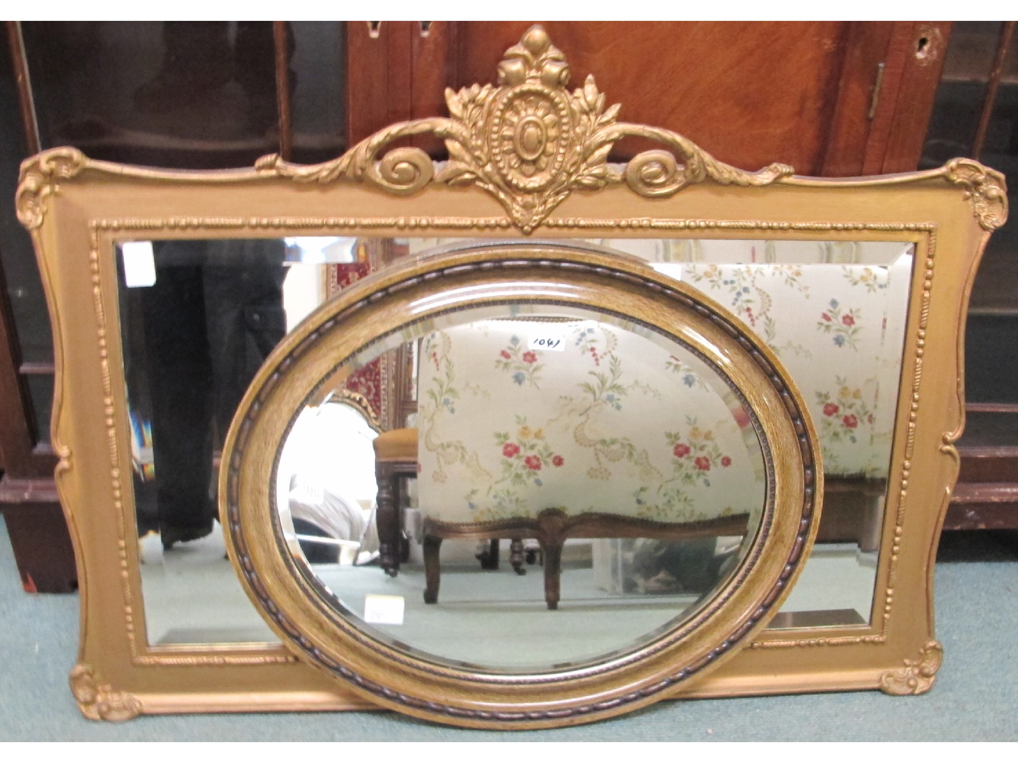 Appraisal: A gilt mirror and an oval mirror