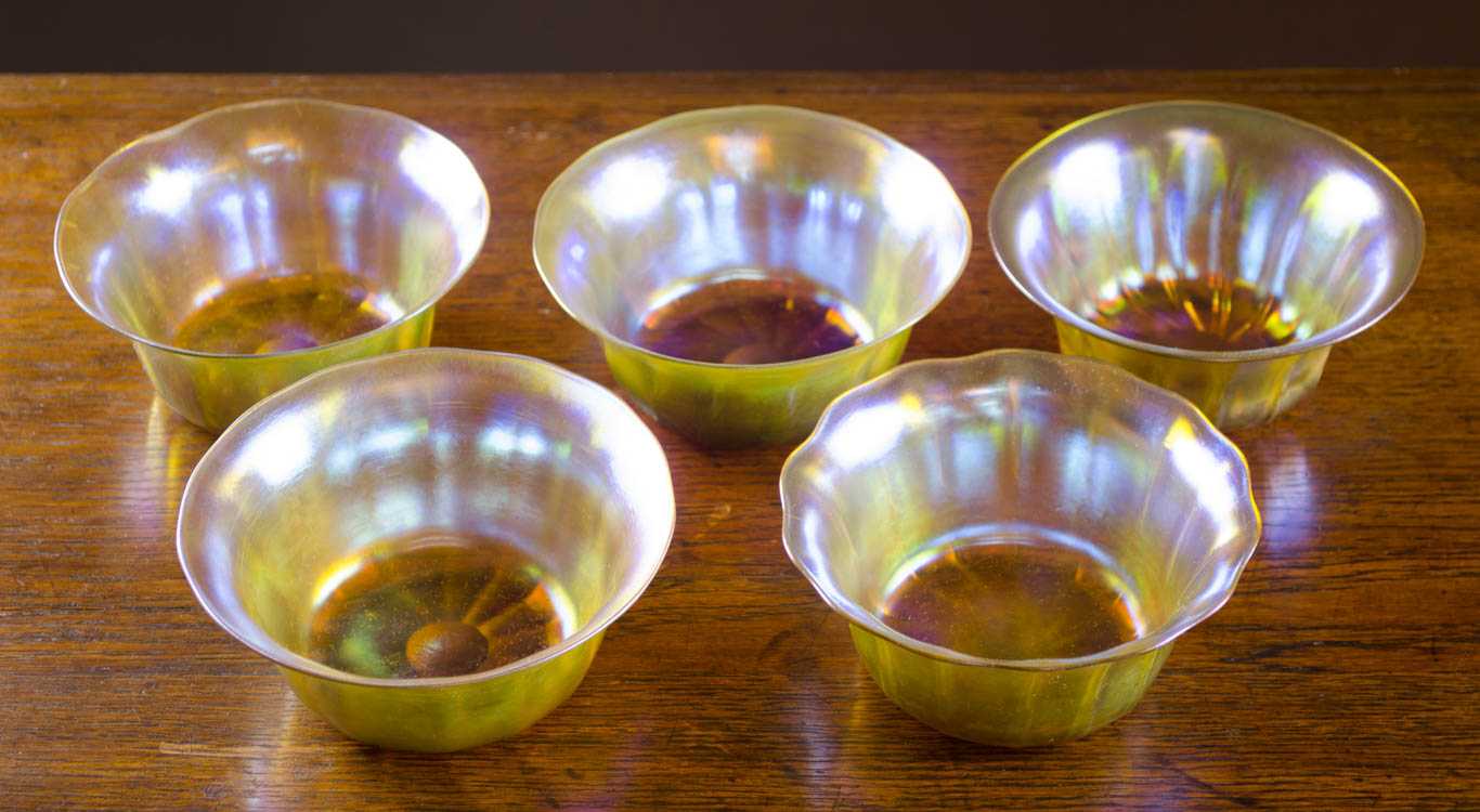 Appraisal: FIVE SIGNED L C TIFFANY FAVRILE ART GLASS BOWLS iridescent