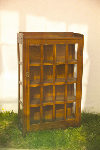 Appraisal: GUSTAV STICKLEY Single-door china cabinet with gallery top and sixteen-pane