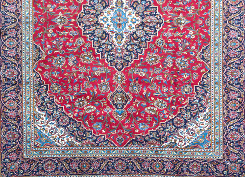 Appraisal: PERSIAN KASHAN Area rug with dark blue and cream center