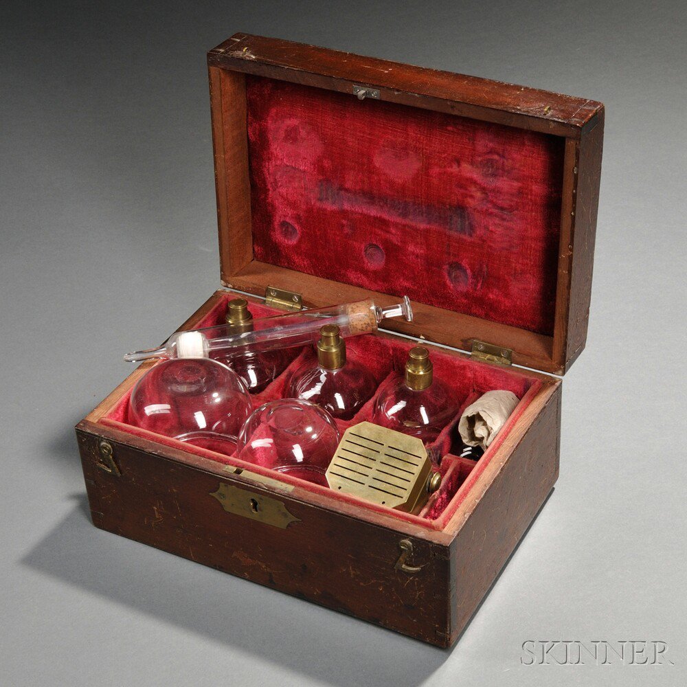 Appraisal: Mahogany-cased Cupping Set th century the dovetailed case with brass