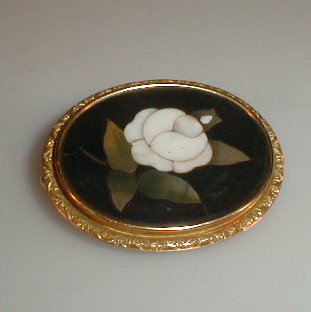 Appraisal: A Victorian mosaic brooch black ground with white rose in