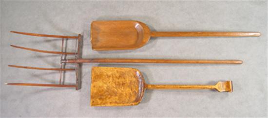 Appraisal: Three Wooden Tools Circa Two hand carved shovels and an