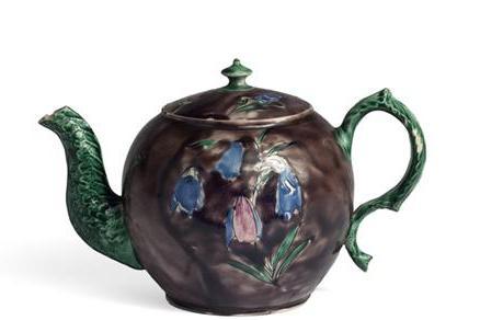 Appraisal: STAFFORDSHIRE SALTGLAZE AUBERGINE-GROUND TEAPOT AND COVER PROBABLY WILLIAM GREATBATCH OR