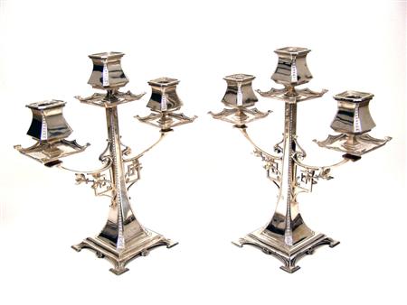 Appraisal: A pair of Edwardian three light candelabra Walker and Hall