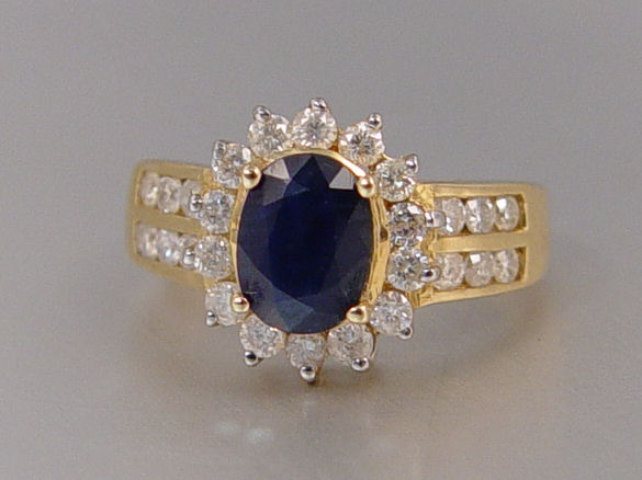 Appraisal: CT SAPPHIRE RING WITH DIAMONDS K yellow gold ring centers