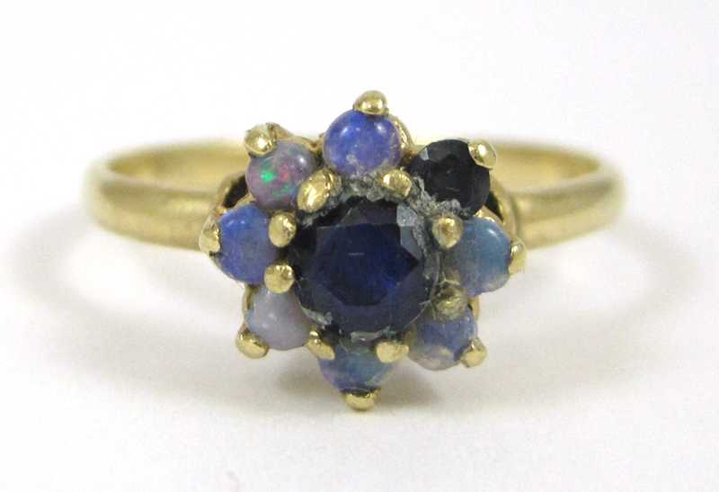 Appraisal: OPAL SAPPHIRE AND FOURTEEN KARAT GOLD RING with seven round