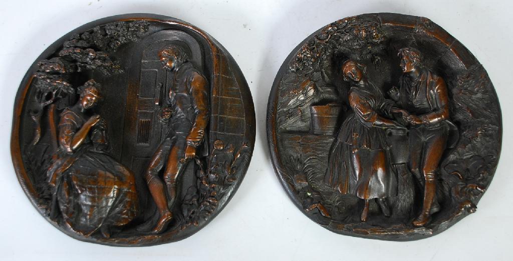 Appraisal: E W WYON PAIR OF BRONZED METAL RELIEF MOULDED CIRCULAR