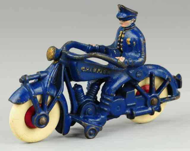 Appraisal: CHAMPION MOTORCYCLE WITH POLICE DRIVER Large scale cast iron cycle