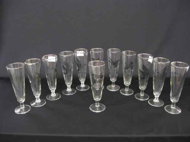 Appraisal: Crystal Tall Champagne Glasseswith various bird decoration '' silver trim