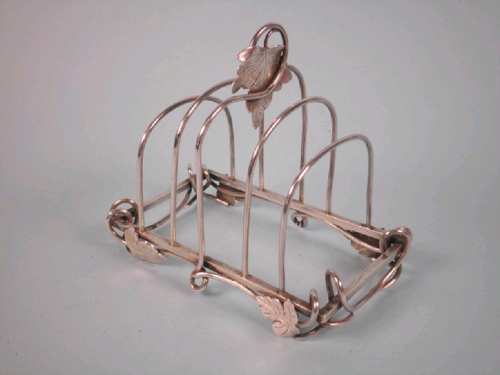 Appraisal: A Edwardian silver four division toast rack cast with leaves