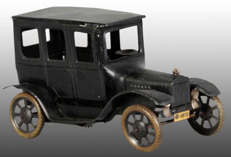 Appraisal: Tin Model T Sedan Car Wind-Up Toy Description German Working