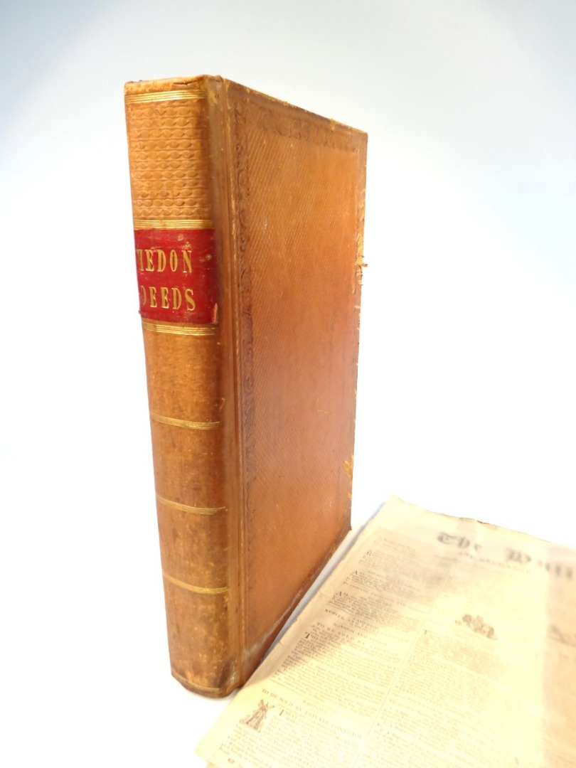 Appraisal: A Hedon pressed leather deeds book Beverley related containing a