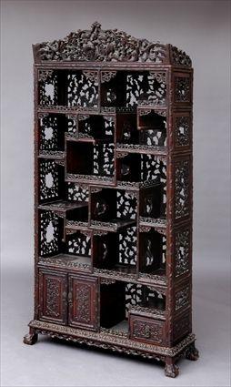 Appraisal: CHINESE CARVED HARDWOOD DISPLAY CABINET ON STAND The pierced crest