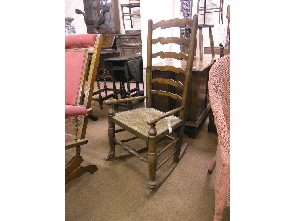 Appraisal: A th century provincial ash ladder back elbow chair with