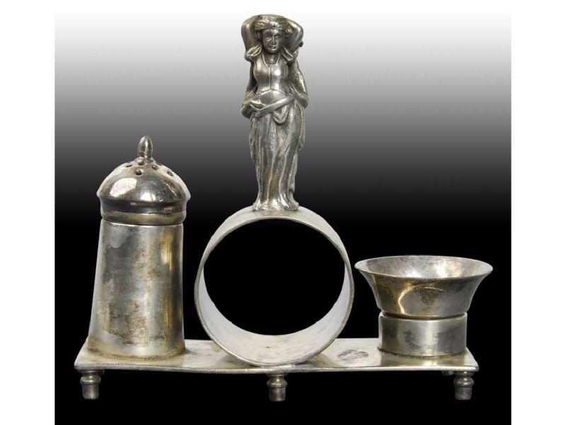 Appraisal: Draped Woman Atop Figural Napkin Ring with Shaker Description Rectangular