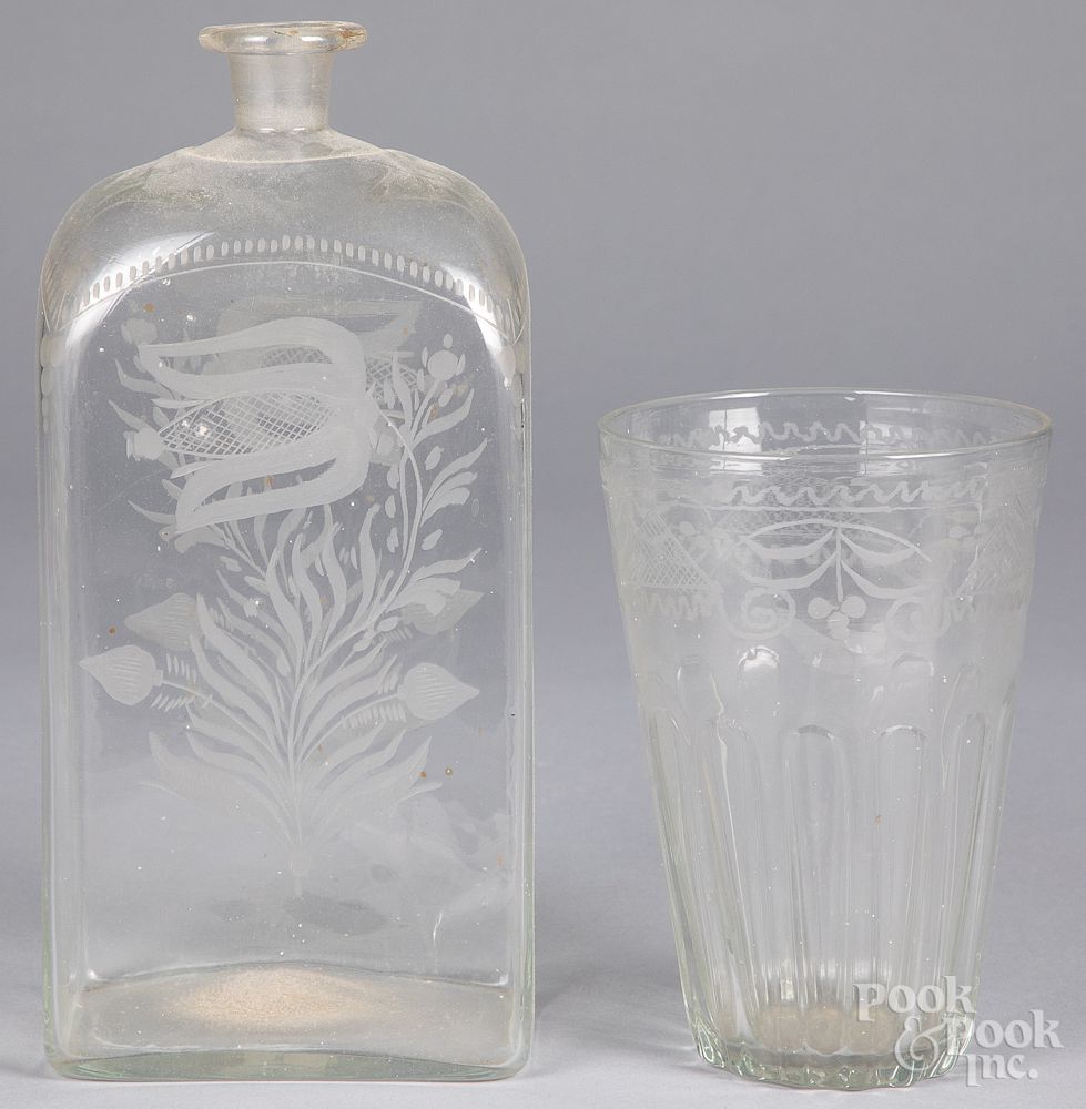 Appraisal: Engraved colorless glass decanter and flip th Engraved colorless glass