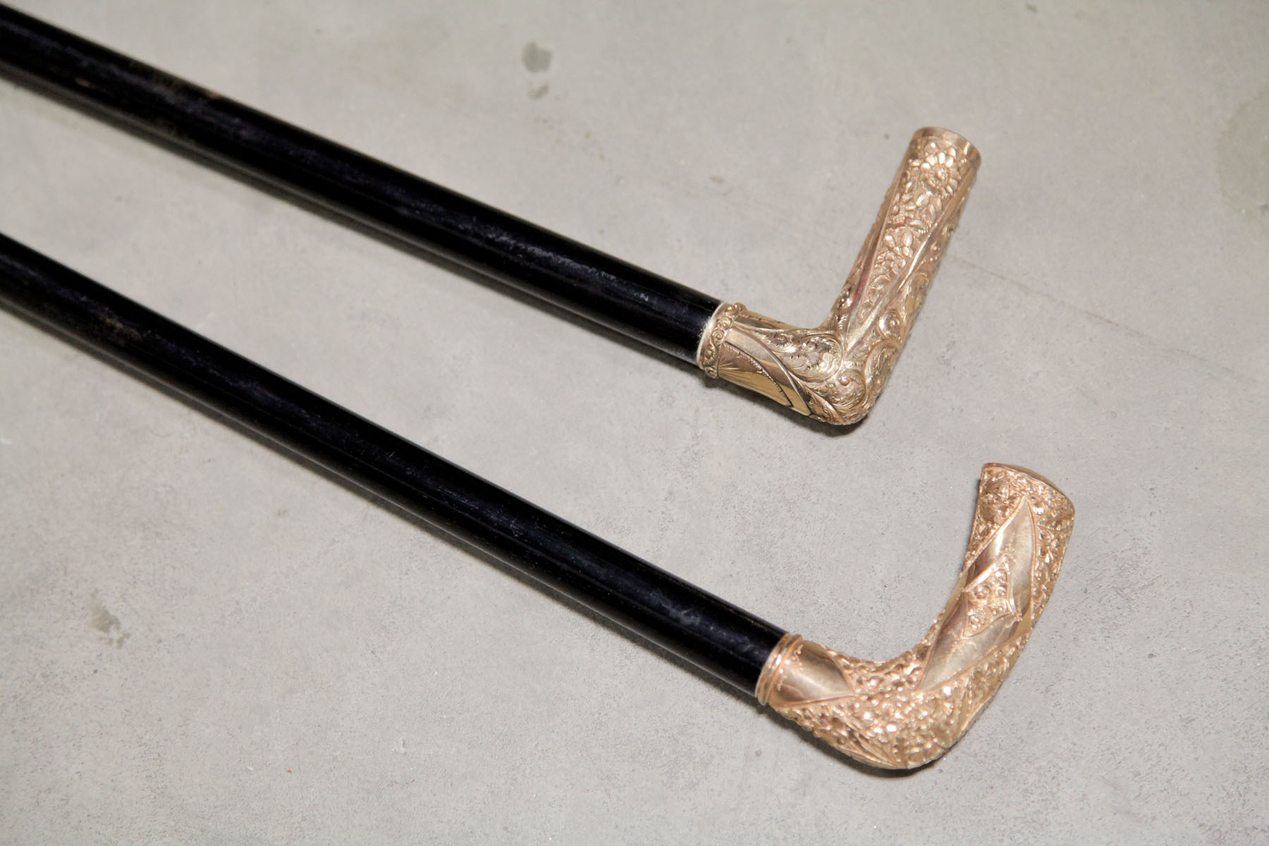 Appraisal: TWO PRESENTATION CANES American late th century Ebonized canes having