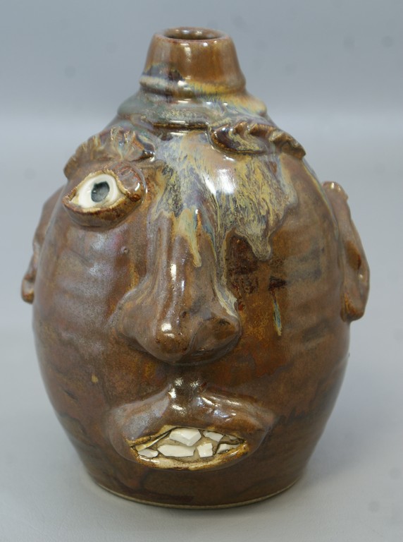 Appraisal: TB Pots pottery one-eyed face jug h