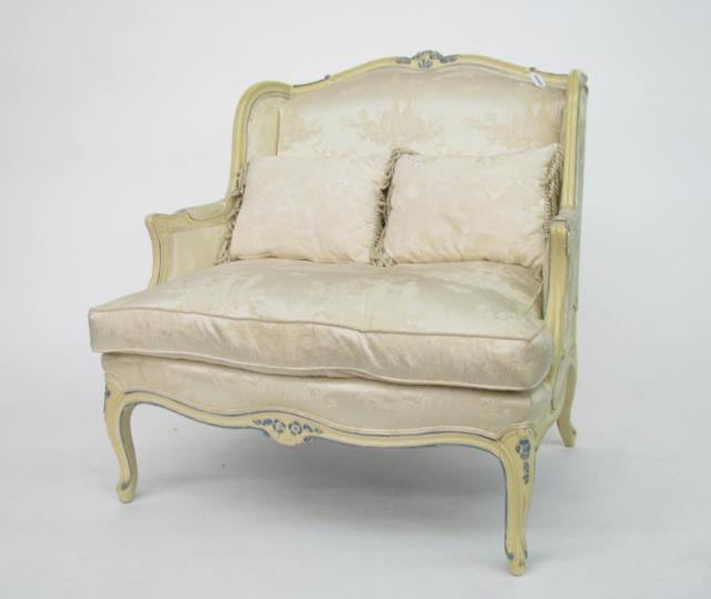 Appraisal: A French style wide Bergere with carved frame later painted