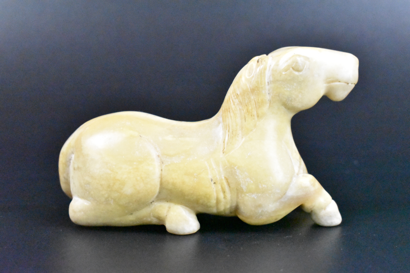 Appraisal: A Chinese jade carving of a horse dating from the