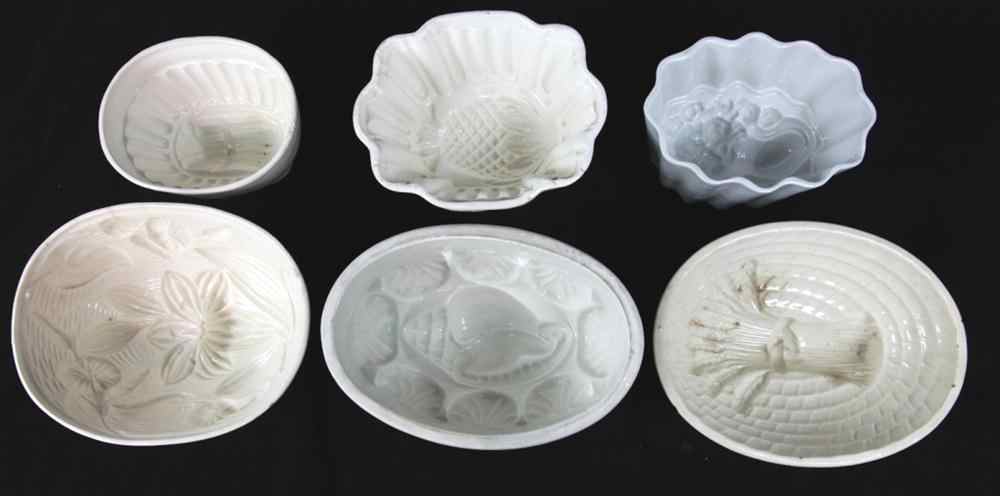 Appraisal: FIVE CERAMIC MOLDS OF PLANTS the sixth of sea shells