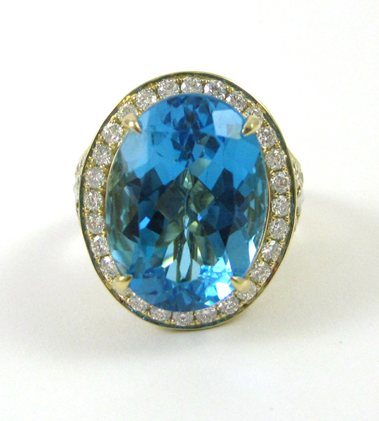 Appraisal: BLUE TOPAZ DIAMOND AND FOURTEEN KARAT GOLD RING with round-cut