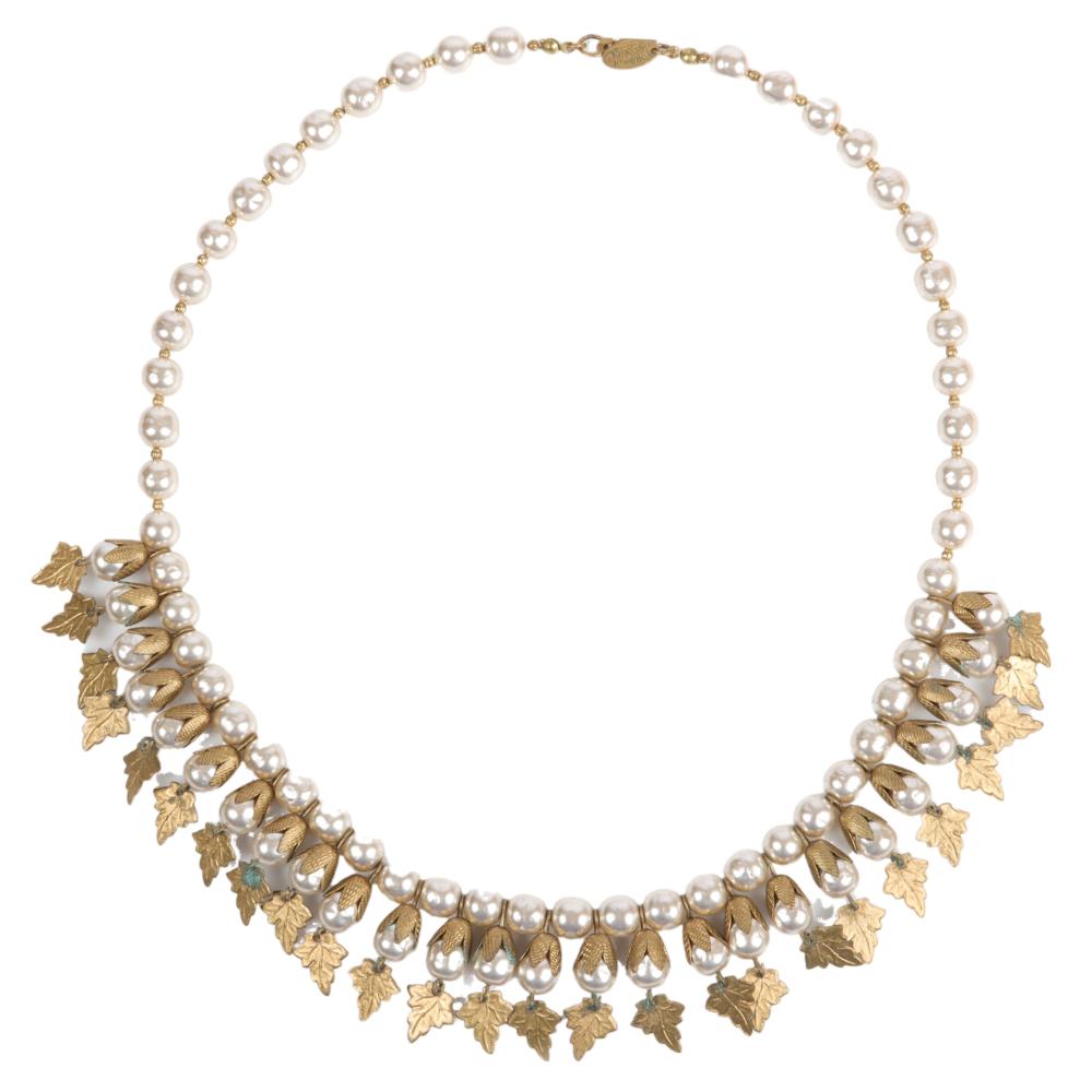 Appraisal: MIRIAM HASKELL BAROQUE CHAMPAIGN PEARL NECKLACE WITH DANGLING BRASS LEAF