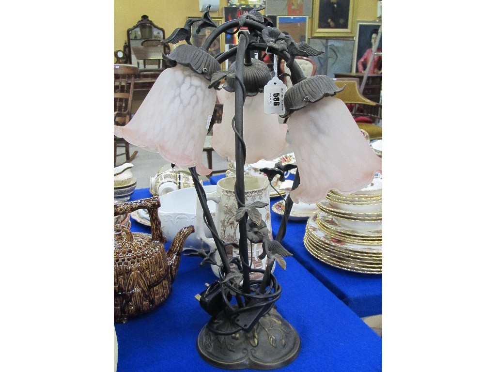 Appraisal: Modern table lamp decorated with humming birds and flowers