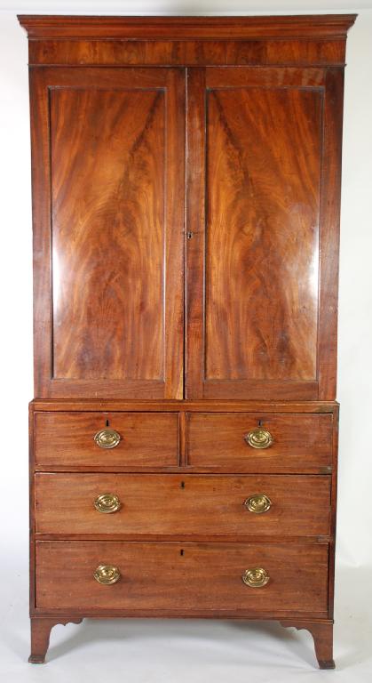 Appraisal: EARLY NINETEENTH CENTURY MAHOGANY PRESS CUPBOARD of narrow proportions the