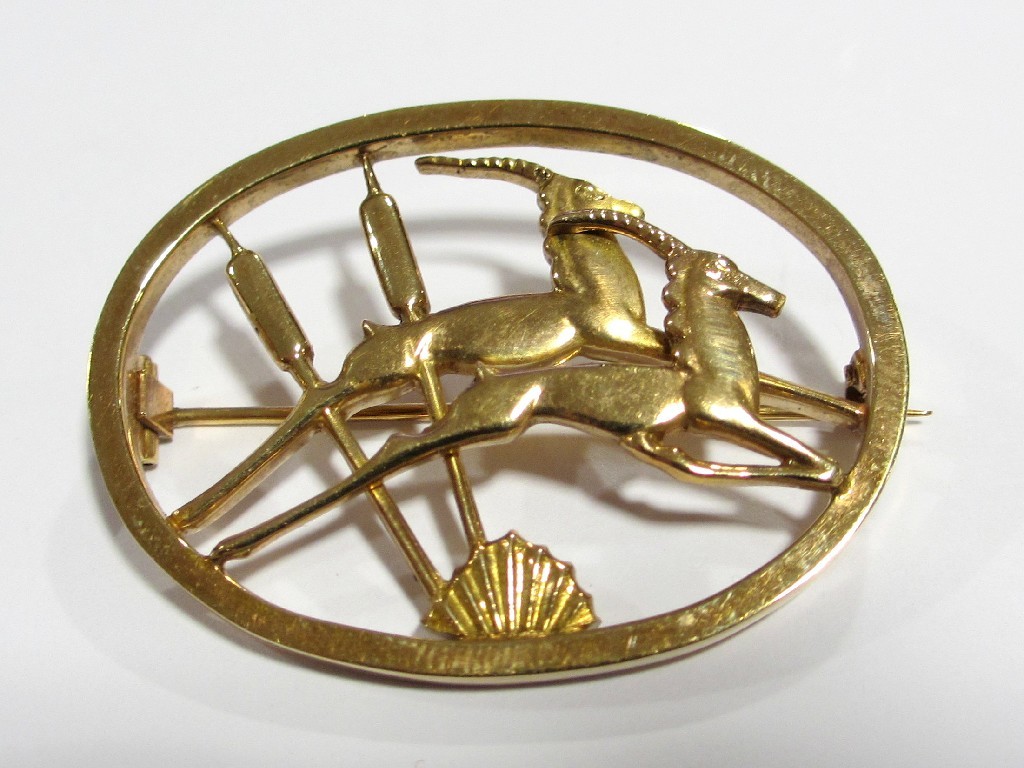 Appraisal: An Ivan Tarratt ct gold oval brooch with antelope and