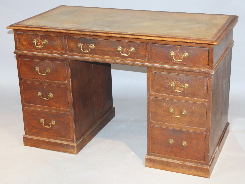 Appraisal: A late thC oak twin pedestal desk the rectangular overhanging