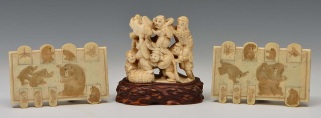 Appraisal: A JAPANESE IVORY OKIMONO carved as Shichifukujin amusing themselves with