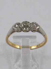 Appraisal: A yellow metal tests ct gold three stone diamond ring