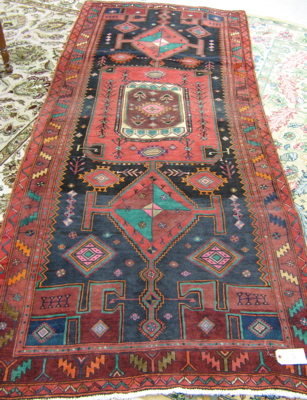 Appraisal: PERSIAN TRIBAL AREA RUG overall geometric design on black ground